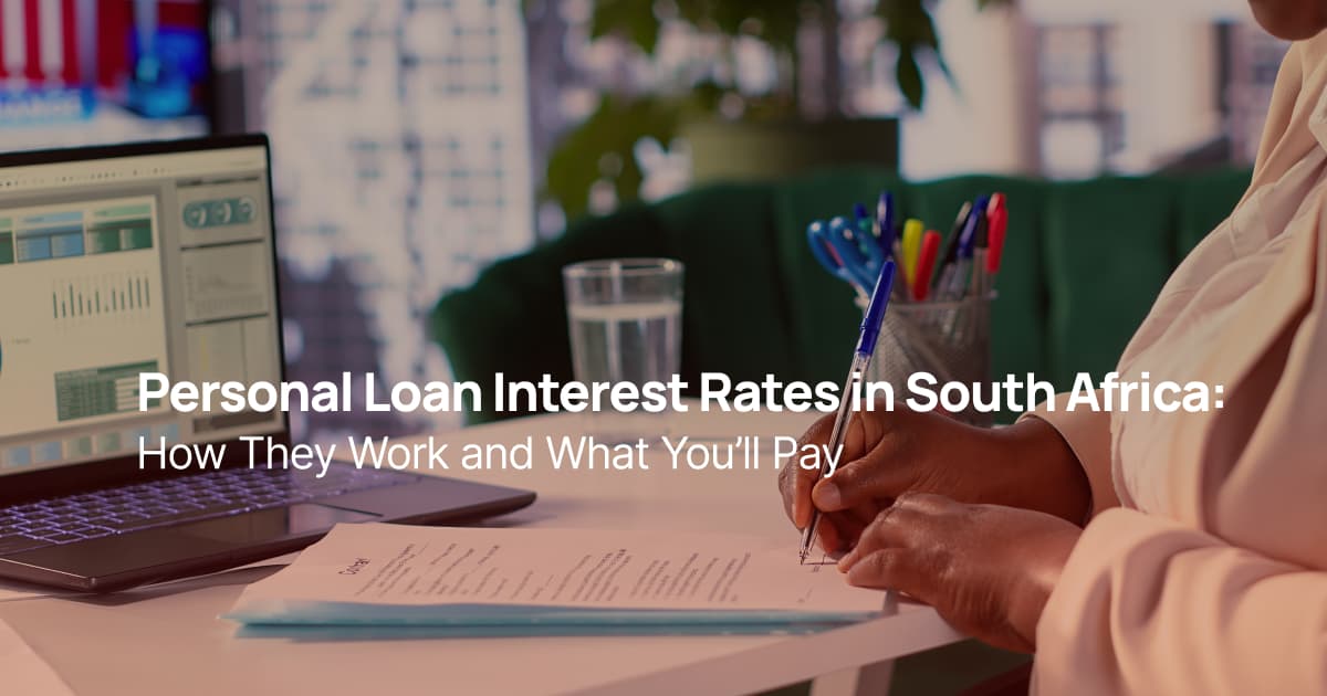 Person signing a personal loan agreement with laptop showing financial data in South Africa