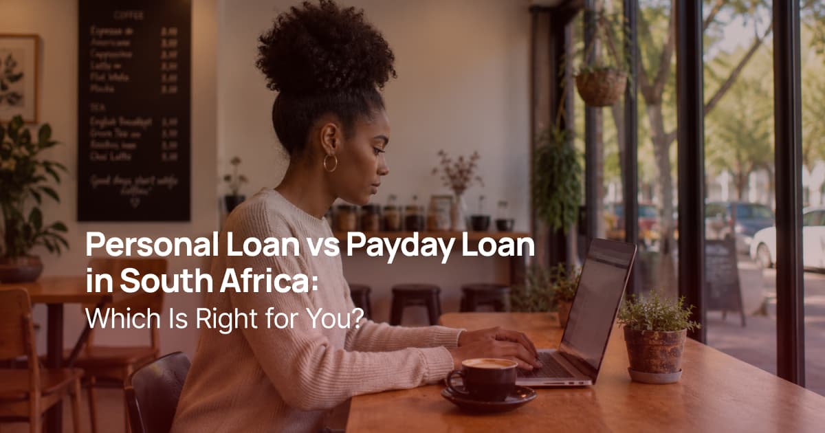 South African woman using a laptop in a coffee shop while comparing personal loan and payday loan options.