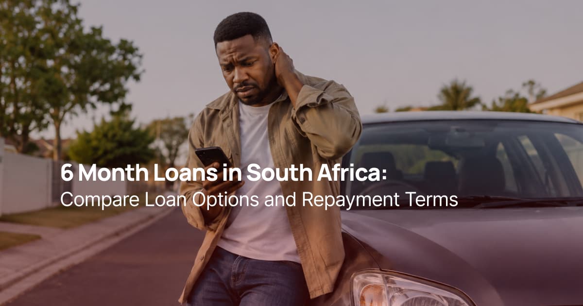 South African man standing next to his car and checking his phone while comparing 6 month loan options for unexpected expenses.